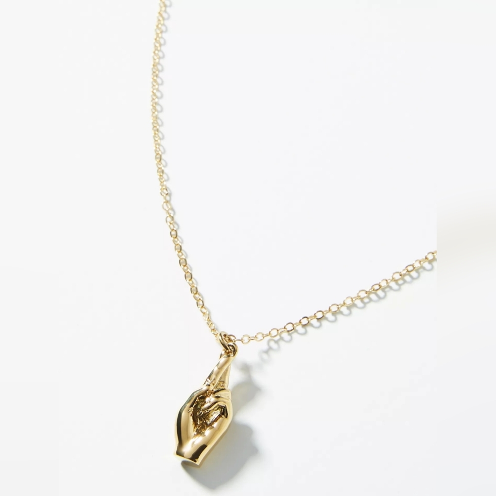 Anthropologie x Sugar Blossom: Gold Good Luck Pendant Necklace - fingers-crossed